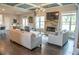Spacious living room features a fireplace, coffered ceiling, and hardwood floors at 3739 In Bloom Way, Auburn, GA 30011