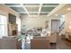 Bright living room with a coffered ceiling, fireplace, and an open floor plan at 3739 In Bloom Way, Auburn, GA 30011