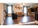 Spacious living room with hardwood floors, ample natural light, and stylish furnishings at 3739 In Bloom Way, Auburn, GA 30011