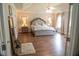Serene main bedroom featuring plush bedding, neutral tones, and decorative accents at 3739 In Bloom Way, Auburn, GA 30011