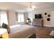 Spacious main bedroom with vaulted ceiling, work space, and ample natural light at 3739 In Bloom Way, Auburn, GA 30011