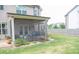 View of the home's screened patio featuring a 'relax' sign, shade, and patio furniture at 3739 In Bloom Way, Auburn, GA 30011