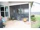 View of the screen patio with outdoor furniture, access to the backyard, and a doggie door at 3739 In Bloom Way, Auburn, GA 30011