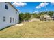 Spacious backyard with well-manicured lawn and a quaint patio area at 3772 Sunbridge Dr, Snellville, GA 30039