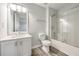 Clean bathroom with vinyl flooring, new vanity, toilet, and shower with glass doors at 3772 Sunbridge Dr, Snellville, GA 30039