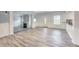 Bright living room featuring a fireplace, large windows, and modern laminate flooring at 3772 Sunbridge Dr, Snellville, GA 30039