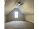 Large bonus room with carpeted floors, neutral paint, and large windows at 3920 Knotts Pass Rd, Snellville, GA 30039