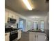 Modern kitchen featuring black countertops, stainless appliances, and updated cabinets at 3920 Knotts Pass Rd, Snellville, GA 30039