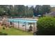 Enjoy community living with access to a refreshing fenced swimming pool surrounded by lush landscaping at 3920 Knotts Pass Rd, Snellville, GA 30039
