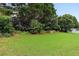 Spacious backyard with healthy green grass, perfect for outdoor activities at 4944 Dovecote Trl, Suwanee, GA 30024