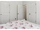 Bedroom features an open doorway and bright white walls at 4944 Dovecote Trl, Suwanee, GA 30024