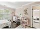 Inviting bedroom with hardwood floors, a white vanity, a plush desk chair, and a charming moon shelf at 4944 Dovecote Trl, Suwanee, GA 30024