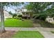 Charming two-story home with well-manicured lawn and lush landscaping, showcasing curb appeal and inviting entrance at 4944 Dovecote Trl, Suwanee, GA 30024