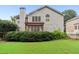 Exterior back of home with a patio, yard, and lots of beautiful landscaping at 4944 Dovecote Trl, Suwanee, GA 30024