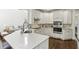 Spacious kitchen with marble counters, stainless steel appliances and fixtures, and hardwood floors at 4944 Dovecote Trl, Suwanee, GA 30024