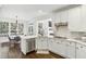 Bright and functional kitchen with updated stainless steel appliances and an adjacent dining area at 4944 Dovecote Trl, Suwanee, GA 30024