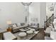 Bright and open living room with high ceilings, modern decor, and plenty of natural light, perfect for entertaining and relaxation at 4944 Dovecote Trl, Suwanee, GA 30024