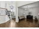 Bright, open-concept living area with hardwood floors, high ceilings, and large windows, perfect for entertaining and relaxing at 4944 Dovecote Trl, Suwanee, GA 30024