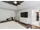 Bright main bedroom features a high ceiling, dark-stained beams, and an ensuite bathroom with a walk-in closet at 4944 Dovecote Trl, Suwanee, GA 30024