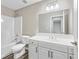 This bathroom has a bath/shower combo and a vanity at 980 Charter Club Dr, Lawrenceville, GA 30043