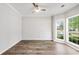 Bright room with wood flooring and windows overlooking the outdoor landscape at 980 Charter Club Dr, Lawrenceville, GA 30043