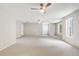 This bonus room has a ceiling fan and a window at 980 Charter Club Dr, Lawrenceville, GA 30043