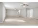 Spacious bonus room features two ceiling fans and an entrance to another room at 980 Charter Club Dr, Lawrenceville, GA 30043