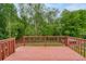 Spacious wooden deck overlooking a green backyard at 980 Charter Club Dr, Lawrenceville, GA 30043