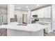 Modern kitchen featuring white cabinets, stainless steel appliances, and marble countertops at 980 Charter Club Dr, Lawrenceville, GA 30043