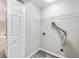 Laundry room with white walls, hardwood floors, and hookups at 980 Charter Club Dr, Lawrenceville, GA 30043