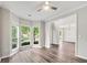 Spacious living room with hardwood floors, large windows, and stylish lighting, creating a welcoming atmosphere at 980 Charter Club Dr, Lawrenceville, GA 30043