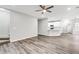 Open living space featuring hardwood floors, a modern kitchen, and staircase, perfect for entertaining or relaxing at 980 Charter Club Dr, Lawrenceville, GA 30043