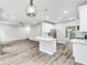 Open-concept living space with a modern kitchen and a spacious living area, perfect for Gathering gatherings at 980 Charter Club Dr, Lawrenceville, GA 30043