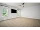 Bright bedroom with plush carpet, natural light, and a sleek ceiling fan at 1059 Rockford Township Sw Dr, Marietta, GA 30064