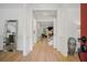 Elegant entryway featuring hardwood floors, white wainscoting, and a glimpse into the living spaces at 1059 Rockford Township Sw Dr, Marietta, GA 30064