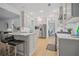 Bright kitchen with white cabinets, stainless steel appliances, and a marble countertop island with seating at 1059 Rockford Township Sw Dr, Marietta, GA 30064