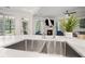 Spacious kitchen sink with marble countertops and view into the living room at 1059 Rockford Township Sw Dr, Marietta, GA 30064