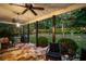 A covered patio with stone flooring, ceiling fans, and outdoor seating, perfect for entertaining at 1059 Rockford Township Sw Dr, Marietta, GA 30064