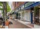 Charming storefronts lining a brick sidewalk with large display windows at 1059 Rockford Township Sw Dr, Marietta, GA 30064