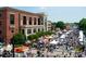 Street fair in Marietta with vendors, food stalls and brick buildings at 1059 Rockford Township Sw Dr, Marietta, GA 30064