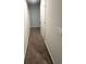Upstairs hallway with carpeted flooring and neutral paint at 119 Deer Xing, Temple, GA 30179