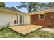 Backyard featuring a wooden deck and a partially fenced yard at 4102 Barr Cir, Tucker, GA 30084