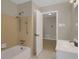 Bathroom featuring a single sink vanity and a shower-tub combo with tile surround at 4102 Barr Cir, Tucker, GA 30084
