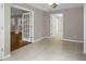 Hallway with tile flooring featuring doorways and french doors leading to other rooms at 4102 Barr Cir, Tucker, GA 30084