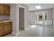 Hallway with a sink and cabinets leading to a sunroom with skylight and french doors at 4102 Barr Cir, Tucker, GA 30084