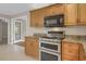 Open concept kitchen features stainless steel appliances, custom cabinets, and granite countertops at 4102 Barr Cir, Tucker, GA 30084