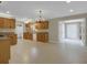 Bright kitchen featuring stainless steel appliances, granite countertops, wood cabinets, and tile flooring at 4102 Barr Cir, Tucker, GA 30084
