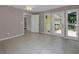 Living room with tile flooring and French doors that lead to an outdoor patio at 4102 Barr Cir, Tucker, GA 30084