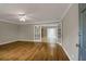 Spacious living room with hardwood floors offering versatile layout options and a modern ambiance at 4102 Barr Cir, Tucker, GA 30084