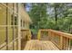 Wooden patio featuring railings, steps, and surrounding foliage at 4102 Barr Cir, Tucker, GA 30084